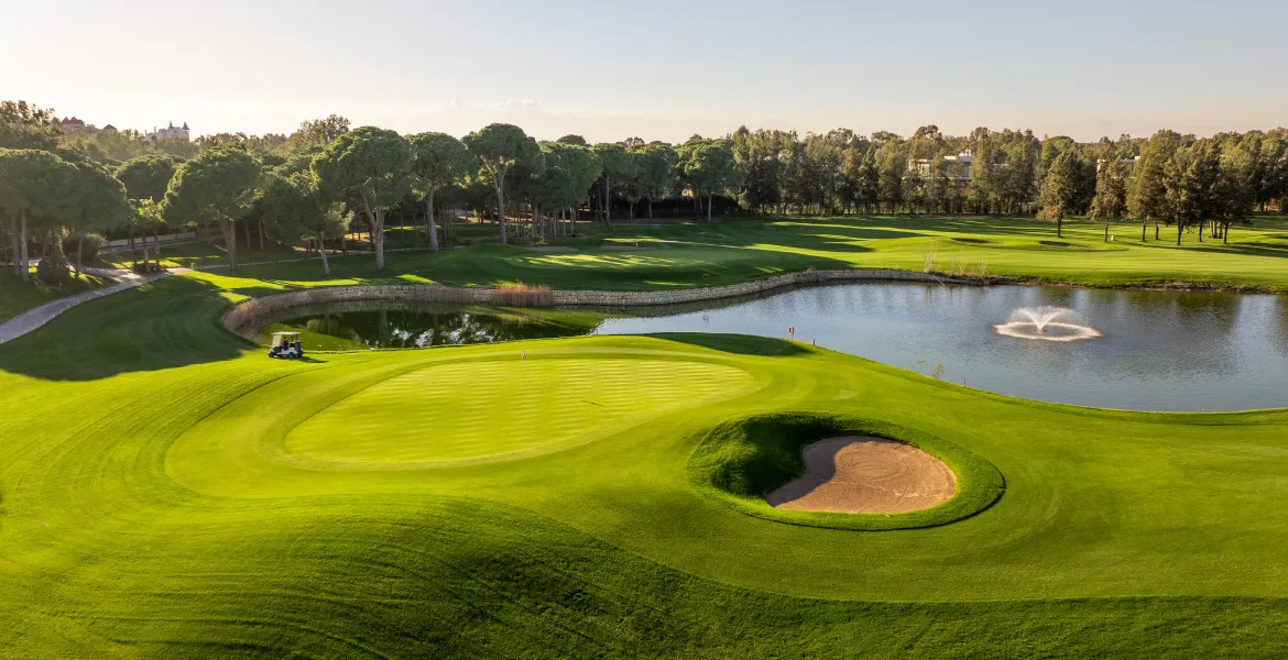 Kaya Palazzo Golf Club · green beside the lake