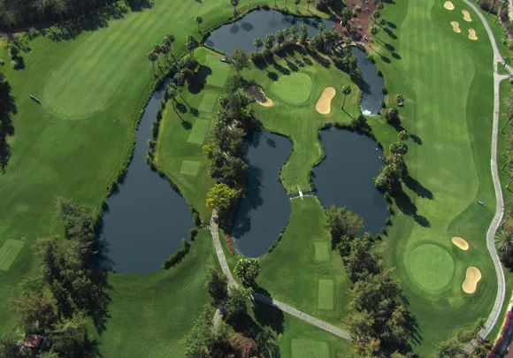 Aerial view of fairways and lakes at Golf Las Américas