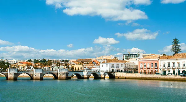 Bridge over the river in Tavira with the town beyond